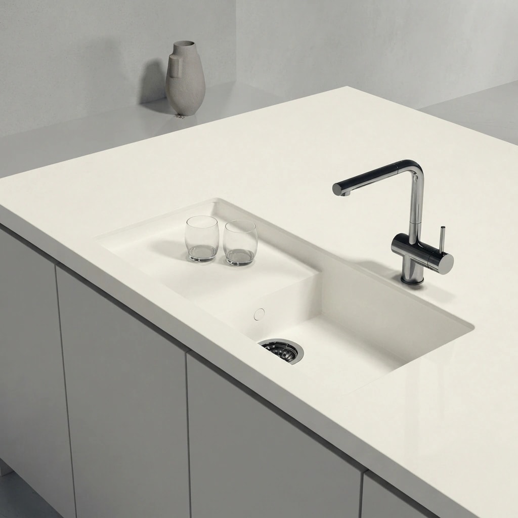 White Dekton Moone Portitxol worktop with integrated sink, chrome tap and two glasses