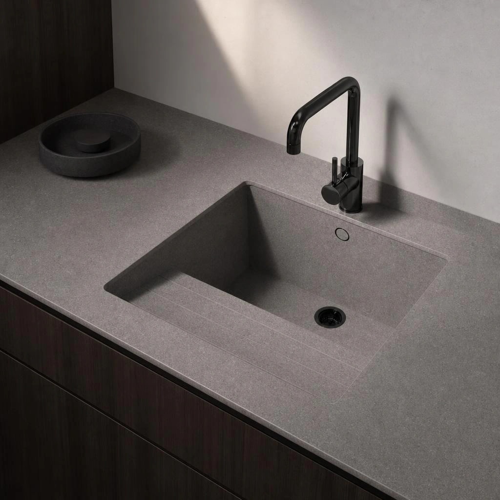 Dekton Sa Talaia countertop in Grafite with integrated sink and black tap