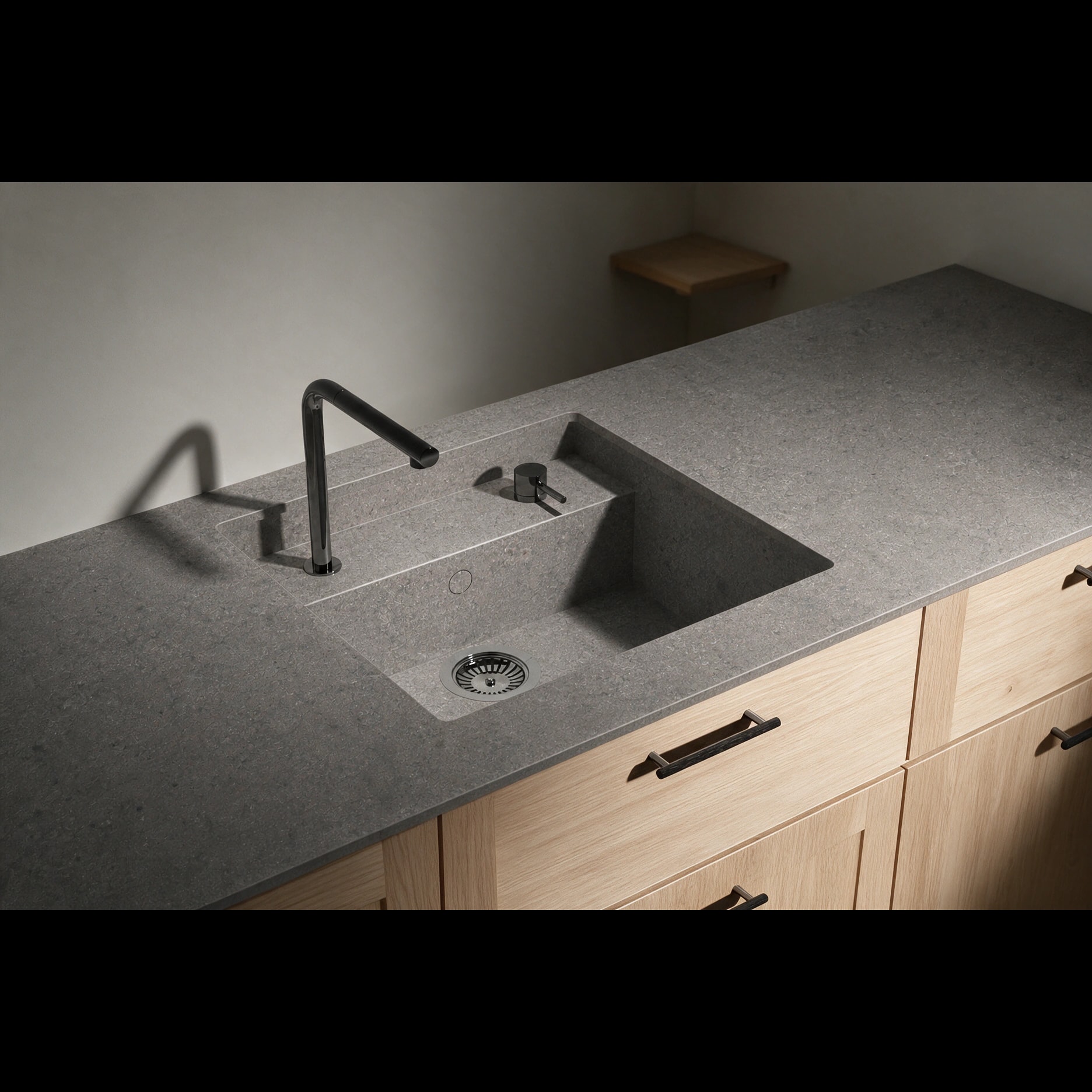 Saladeta sink integrated into a Dekton Grafite kitchen countertop.